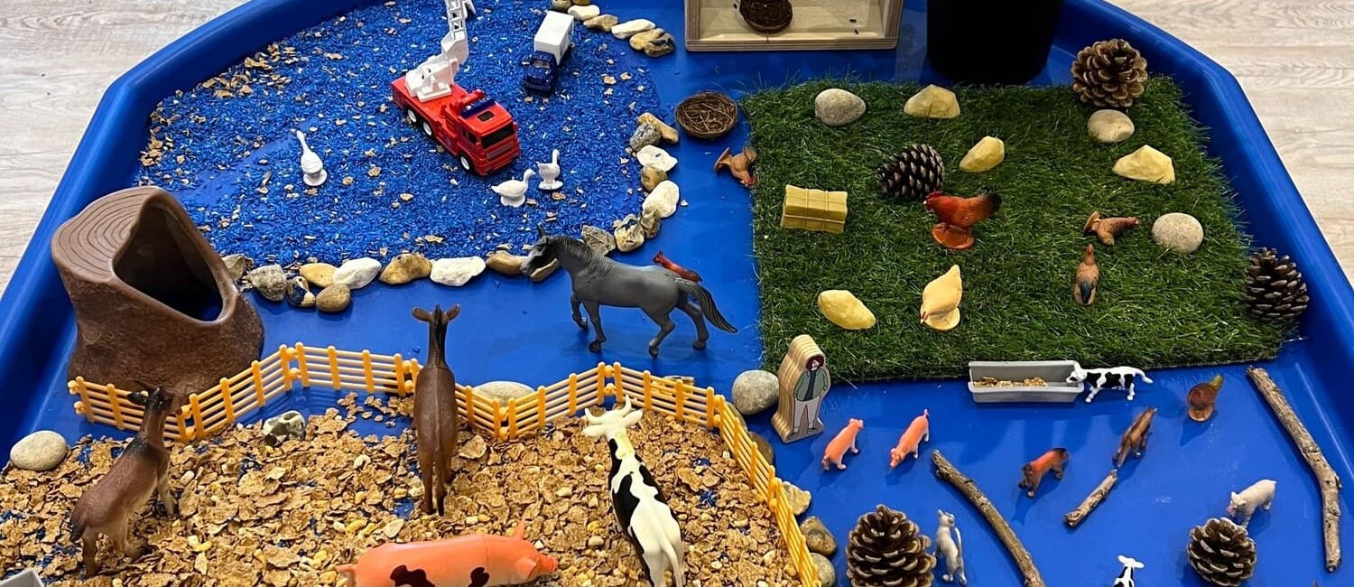 A small-world investigation with animals, natural materials, and vehicles