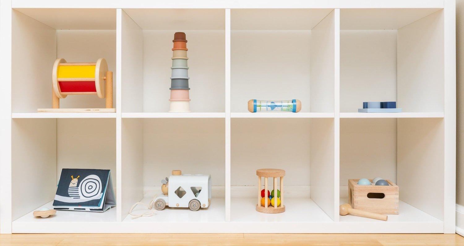 Montessori-style wooden learning materials arranged on open shelves